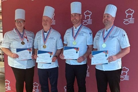 Culinary Team of Jonathon Kersting, Sean Docker, Ryan Rodenhaus, and Megan Baily, receiving the gold medal award