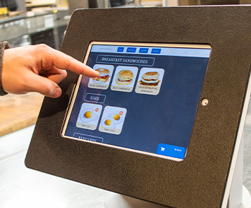 Customer ordering off the breakfast tablet