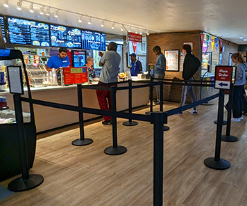 Order and pickup queue at the Cellar, also showing their digital sign menuboards