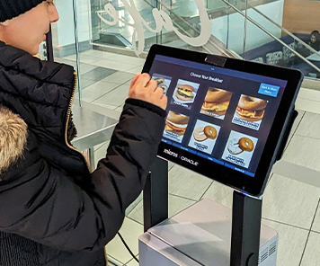 Customer ordering off the self-order kiosk