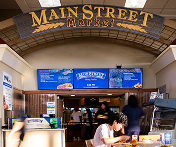Main Street Market sign with our digital signage showing Breakfast options and
