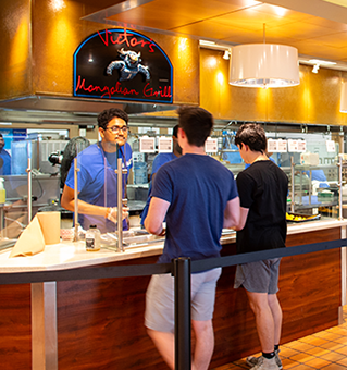 Students ordering from Victor's Mongolian Grill