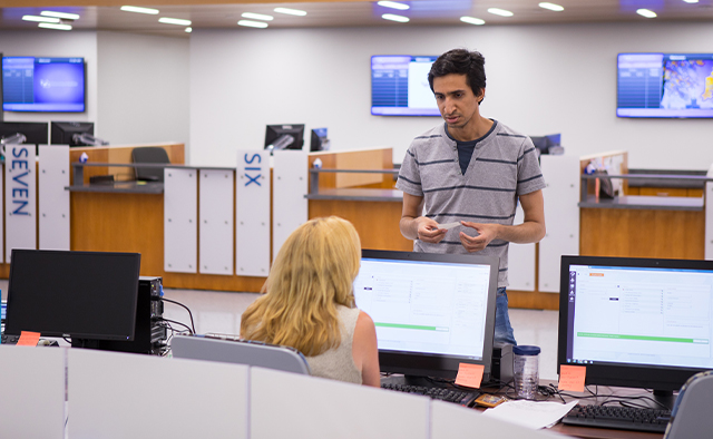 Student working with associate to receive their UB Card