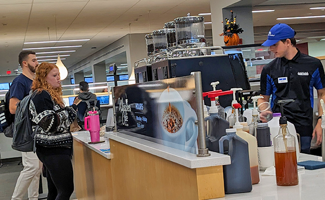 Students in line to order at Whispers Café in Capen Hall, photo taken from the right
