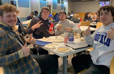 Students seated enjoying pancakes and sausage at Crossroads Culinary Center (C3)