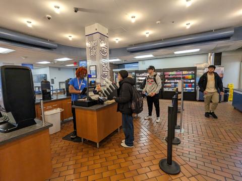 Student checking out with an associate at Capen Café in Capen Hall.