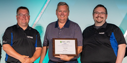 Ray Kohl, Eric Blackledge and Tim Malley holding the Sustainability Award plaque 