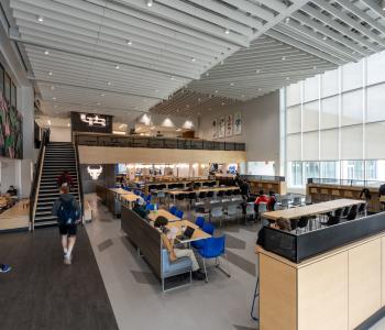 Bigger seating area with stairs leading to second floor seating area