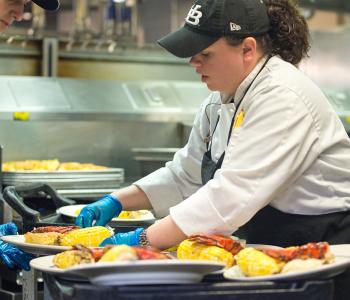 Chef Meghan at Lobster Night in Crossroads Culinary Center (C3) in Ellicott Complex on North Campus. Photographer: Onion Studio
