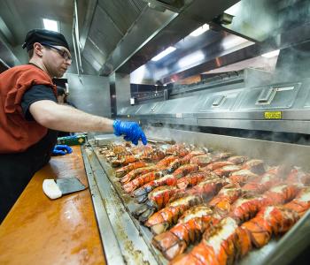 Cooking lobster at Lobster Night in Crossroads Culinary Center (C3) in Ellicott Complex on North Campus. Photographer: Onion Studio