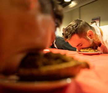 Pie eating contest during the Apple Event at Crossroads Culinary Center (C3) in Ellicott Complex on North Campus