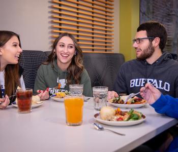 Students eating dinner at the Apple Event at Crossroads Culinary Center (C3) in Ellicott Complex on North Campus