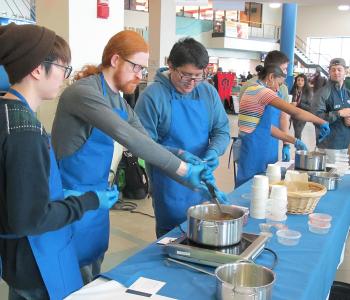 Students participating in Chef Neal Plazio's cooking lesson in the Student Union on North Campus
