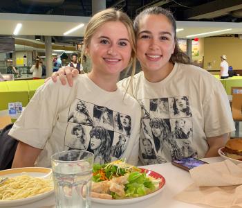 Students eating and wearing Taylor Swift shirts