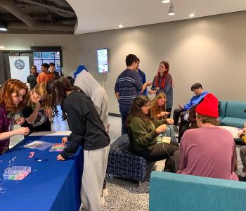 Students making friendship bracelets