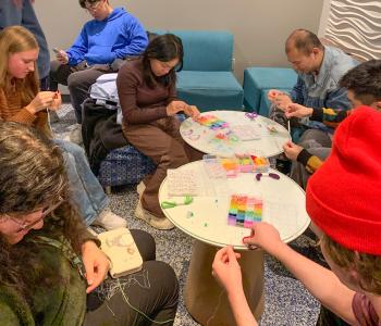 Students making friendship bracelets