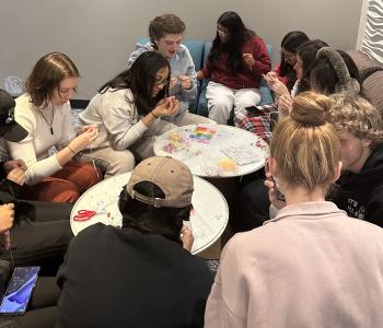 Students making friendship bracelets