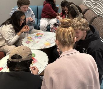 Students making friendship bracelets