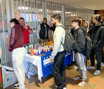 Students lining up to use the Coke claw machine