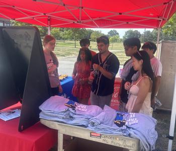 Students playing one more game to try and win a prize of a t shirt