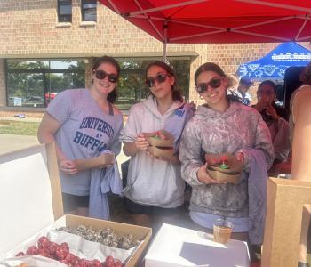 Students posing in the snack tent