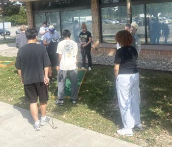 Students playing mini golf