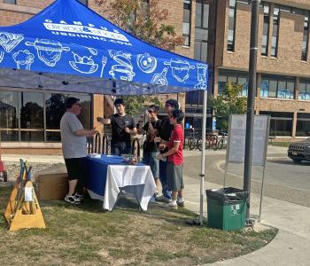 Students conversing with our marketing director Ray Kohl