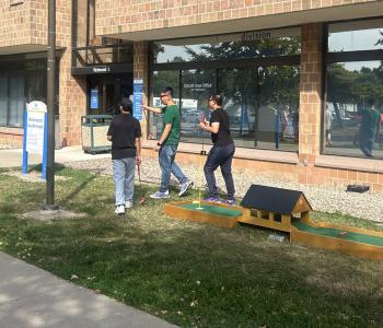 Students playing mini golf