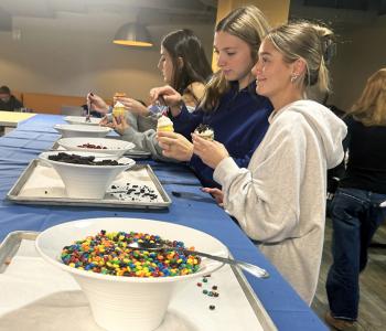 Students decorating their cupcakes