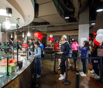 Students lining up to get food at Foundations. Photo by Onion Studio.