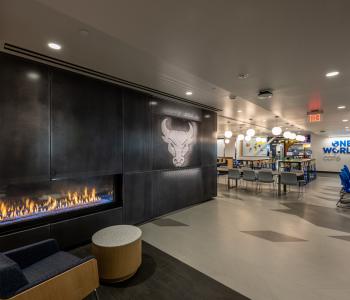 Fireplace seating area outside One World Café. Photo by Onion Studio.