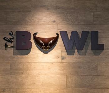 Closeup of The Bowl 3D sign on the wall outside the unit.