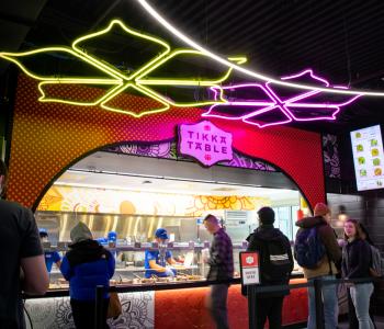 Students in line to order from Tikka Table at One World Café.