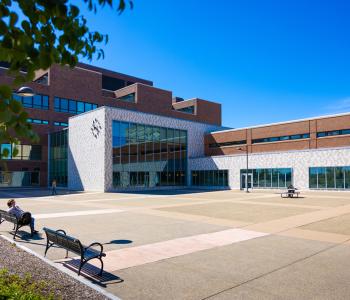 The exterior of One World Café, part of Norton Hall, and Founders Plaza. Photo by Douglas Levere.