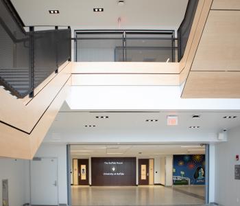 Interior of the hallway between Norton and Capen Halls, where the stairs are that lead up to One World Café. Photo by Douglas Levere.