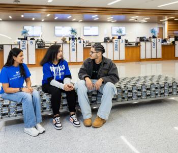 Students chatting on the couches at 1Capen. Photo by Meredith Forrest Kulwicki.
