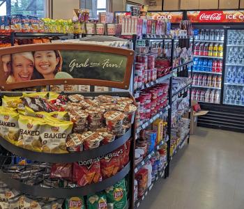 Inside Main Street Store, where chips and snacks line the shelves and Coca-Cola products are in the large cooler in the back.