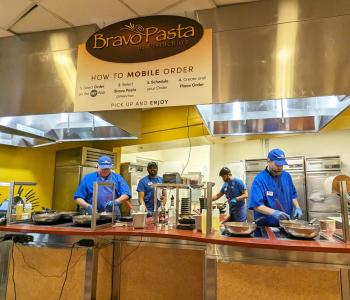 Bravo Pasta associates preparing pasta dishes at the second floor of the Student Union.
