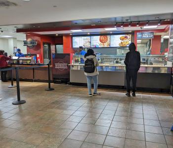 Students lining up to order at Hubies in Ellicott Food Court.