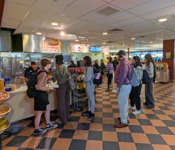 A line forming at the Bravo Pasta pickup and Edgy Veggies checkout counter at the second floor of the Student Union.