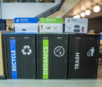 Trash options at One World Café featured labeled for bins labeled “Recycle,” “Organics” and “Trash” (also referred to as R.O.T.)