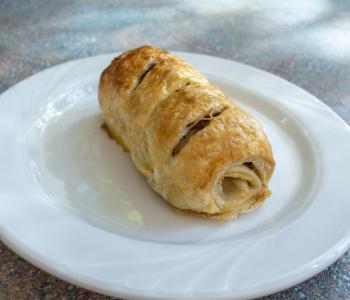 kosher deli pastry roll with pastrami, turkey and mustard inside